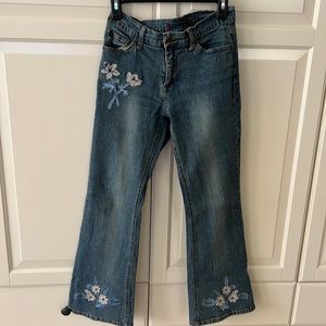 Bootcut with beautiful flowers. Girls 14, fits women size 4. Very lightly used.